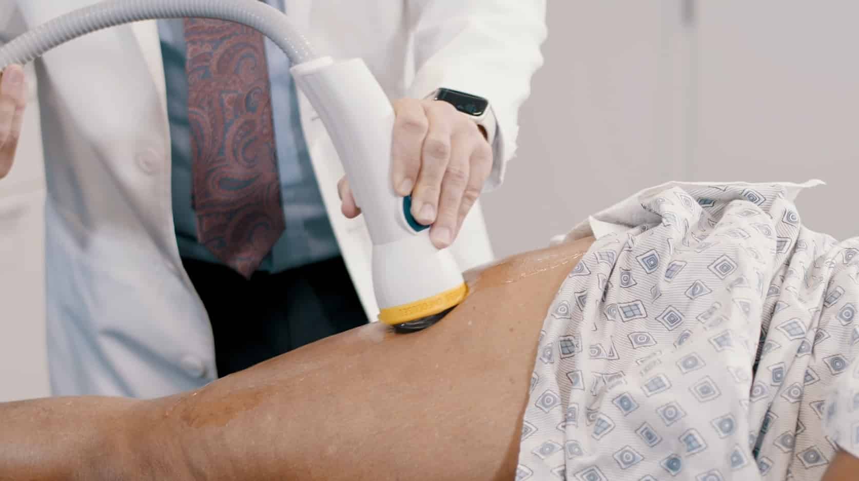 SoftWave Therapy on back of a patient.
